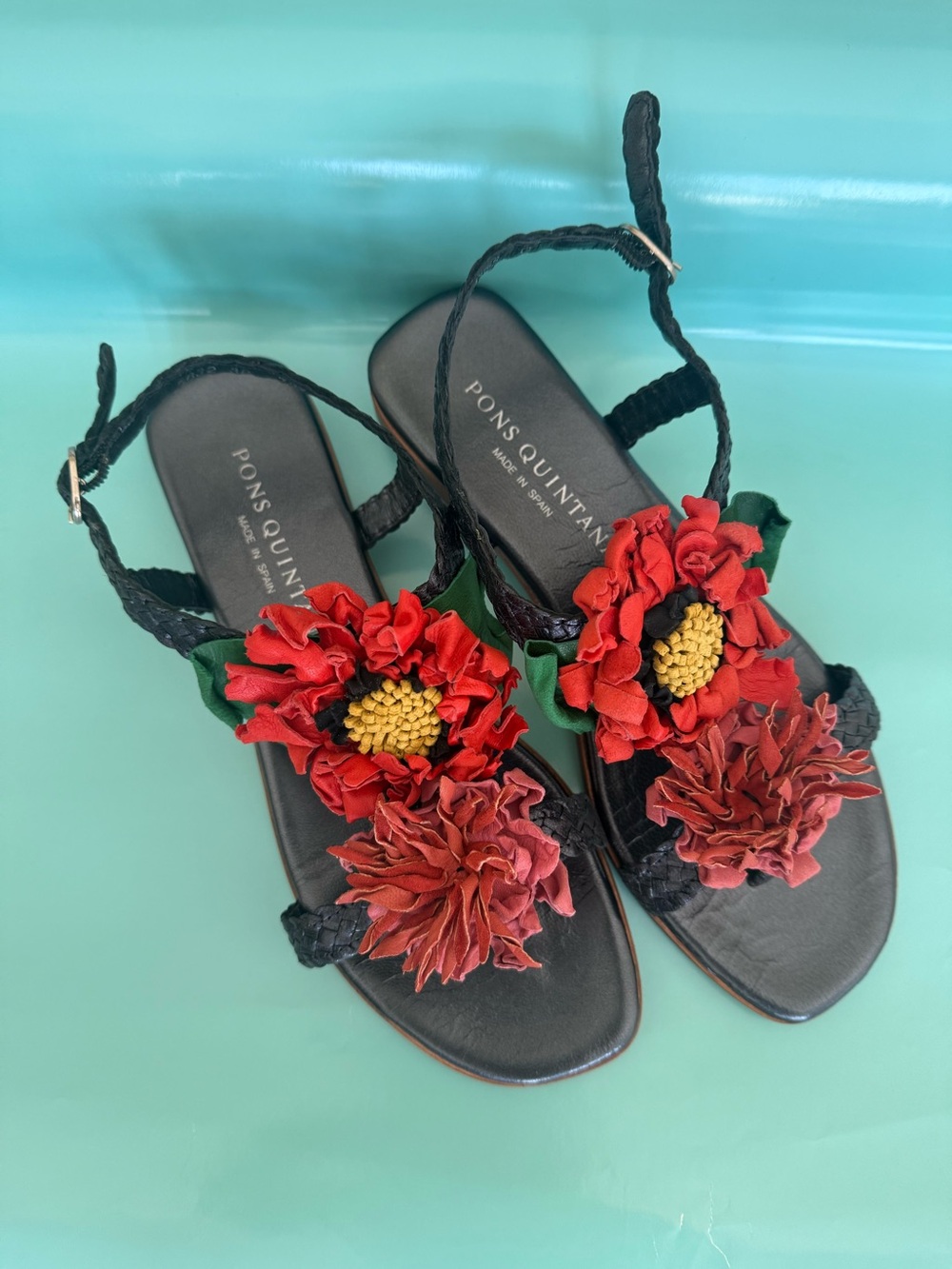 Pons Quintana Black Sandals with Red Floral Embellishments
